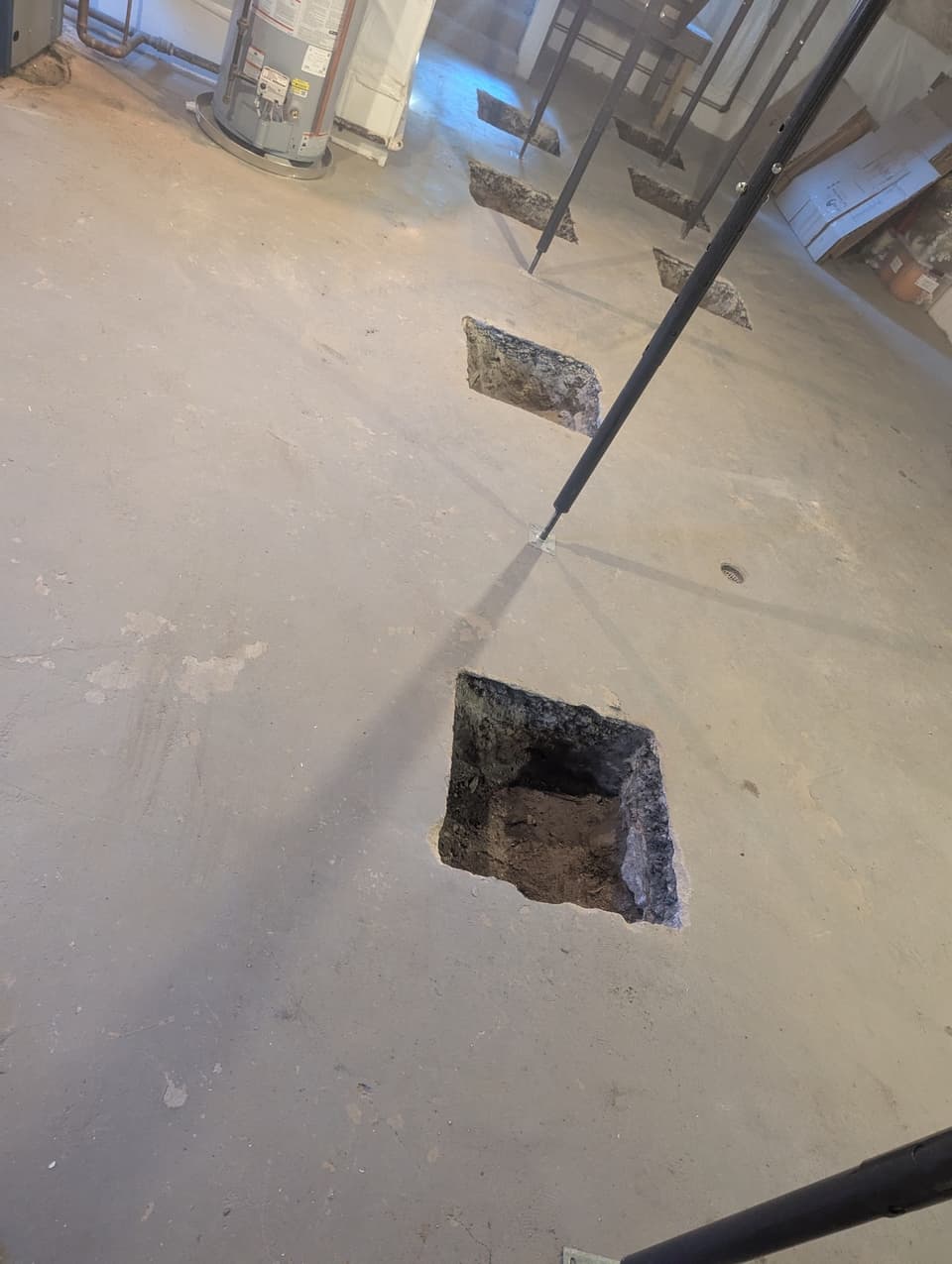 Slab opened to expose the footing and soil below