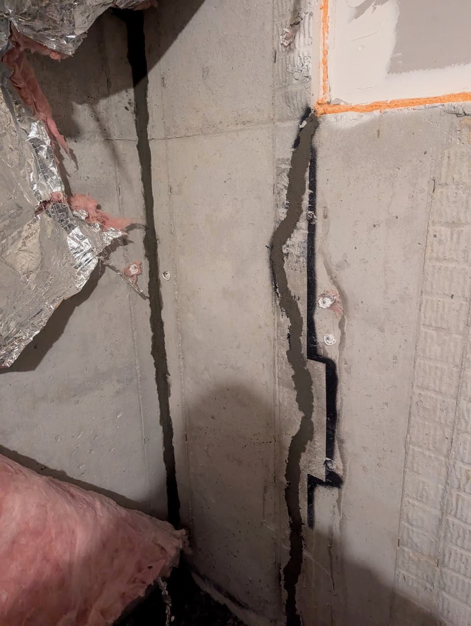 Long diagonal crack in a structural block wall